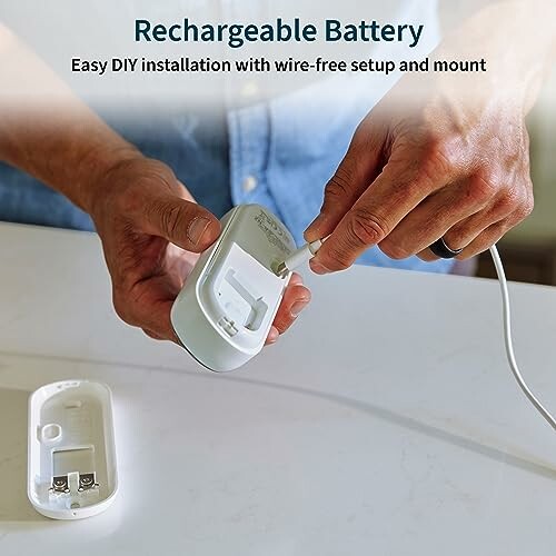 Person installing rechargeable battery with easy DIY setup.