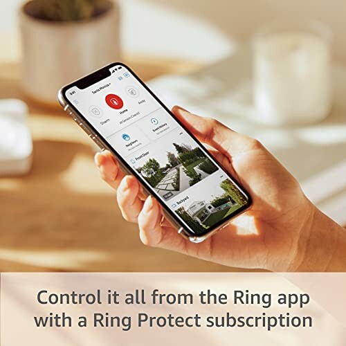 Person holding smartphone with Ring app interface, promoting Ring Protect subscription.