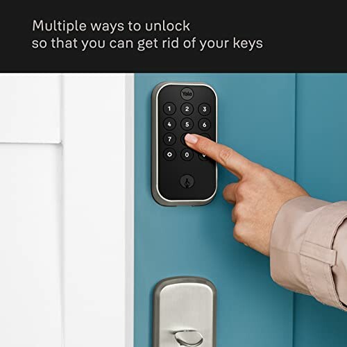 Person using keypad on smart lock door