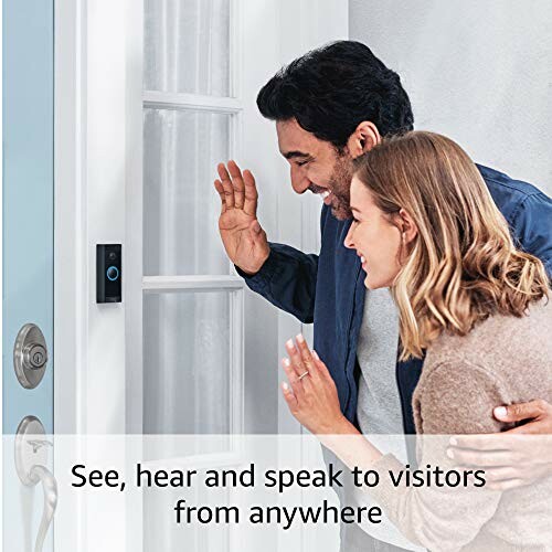 Two people using a video doorbell to greet a visitor.